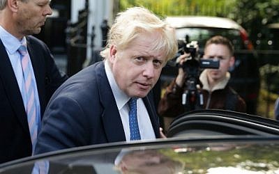 British Foreign Secretary Boris Johnson gets into a car as he leaves his home in London on July 15, 2016.  (AFP PHOTO / DANIEL LEAL-OLIVAS)