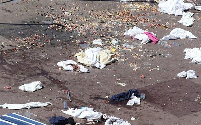 This picture taken on July 15, 2016, shows the site where a truck drove into a crowd watching a fireworks display on the Promenade des Anglais seafront in the French Riviera town of Nice on July 15, 2016.
An attack in Nice where a man rammed a truck into a crowd of people left 84 dead and another 18 in a "critical condition", interior ministry spokesman Pierre-Henry Brandet said Friday. An unidentified gunman barrelled the truck two kilometres (1.3 miles) through a crowd that had been enjoying a fireworks display for France's national day before being shot dead by police.
 / AFP PHOTO / Valery HACHE