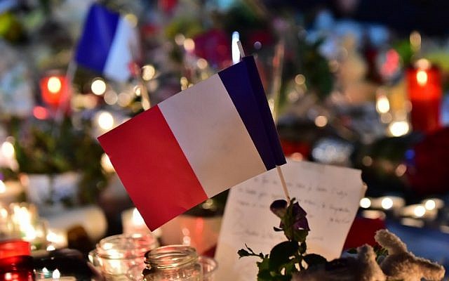This photo taken on July 15, 2016 in Nice, shows a French flag at a make-shift memorial for victims of the deadly Bastille Day attack in the city that killed 84 people and some 200 more. (AFP PHOTO/GIUSEPPE CACACE) This photo taken on July 15, 2016 in Nice, shows a French flag at a make-shift memorial for victims of the deadly Bastille Day attack in the city that killed 84 people and some 200 more. (AFP PHOTO/GIUSEPPE CACACE)