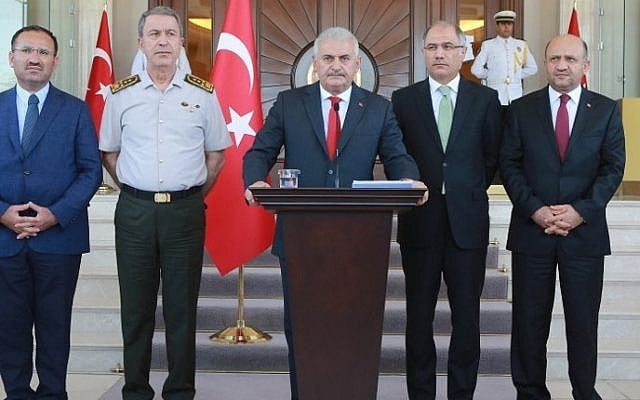 Turkish Prime Minister Binali Yildirim (C), flanked by Turkish Justice Minister Bekir Bozdag (L), Chief of the General Staff of the Turkish Armed Forces Hulusi Akar (2nd L), Turkish Interior Minister Efkan Ala (2nd R) and Turkish Defence Minister Fikri Isik (R), gives a press conference outside the Cankaya Palace in Ankara, on July 16, 2016. (AFP PHOTO/ADEM ALTAN) Turkish Prime Minister Binali Yildirim (C), flanked by Turkish Justice Minister Bekir Bozdag (L), Chief of the General Staff of the Turkish Armed Forces Hulusi Akar (2nd L), Turkish Interior Minister Efkan Ala (2nd R) and Turkish Defence Minister Fikri Isik (R), gives a press conference outside the Cankaya Palace in Ankara, on July 16, 2016. (AFP PHOTO/ADEM ALTAN)