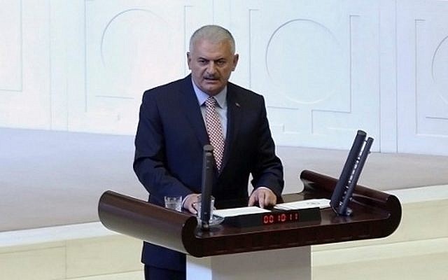Turkish Prime Minister Binali Yildirim delivers a speech during an extraordinary session of the Turkish Parliament in Ankara on July 16, 2016, following a failed coup attempt. (AFP Photo/Adem Altan)