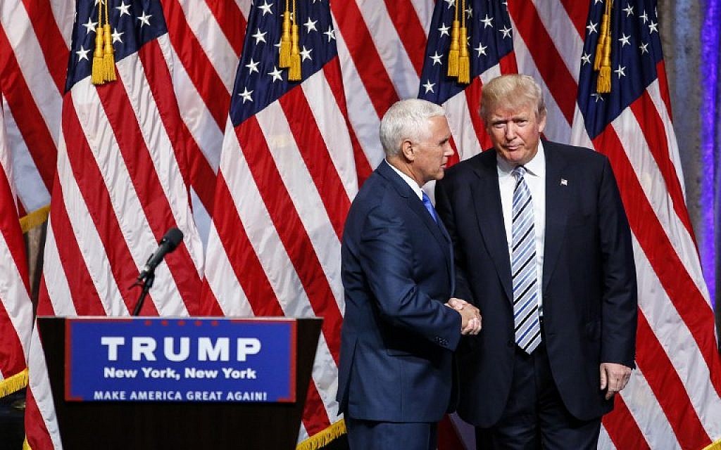 US Republican presidential candidate Donald Trump (R) shakes hands with vice presidential candidate Mike Pence on July 16, 2016, during a press conference in New York. (AFP PHOTO/KENA BETANCUR) US Republican presidential candidate Donald Trump (R) shakes hands with vice presidential candidate Mike Pence on July 16, 2016, during a press conference in New York. (AFP PHOTO/KENA BETANCUR)