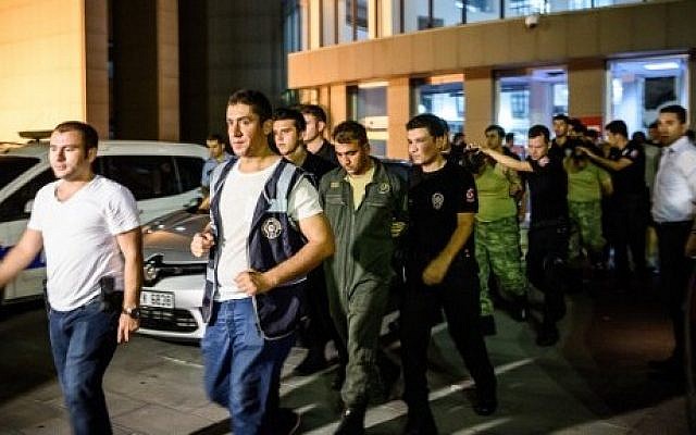 Turkish anti-riot police escort soldiers who allegedly took part in a military coup, as they leave a courthouse in Istanbul on July 16, 2016. (AFP PHOTO/OZAN KOSE) Turkish anti-riot police escort soldiers who allegedly took part in a military coup, as they leave a courthouse in Istanbul on July 16, 2016. (AFP PHOTO/OZAN KOSE)