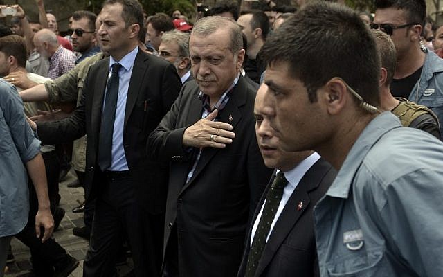 Turkish President Recep Tayyip Erdogan vowed on July 17 to purge the "virus" within state bodies, during a speech at the funeral of victims killed during the coup bid he blames on his enemy Fethullah Gulen. (AFP PHOTO / ARIS MESSINIS)