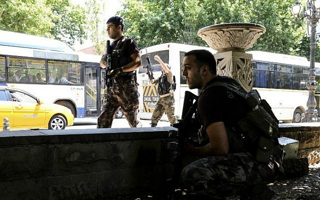 Turkish police officers operate in front of the courthouse on July 18, 2016, in Ankara. (Ilyas Akengin/AFP)