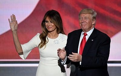 US Republican presidential candidate Donald Trump stands with his wife Melania on the final night of the Republican National Convention at the Quicken Loans Arena in Cleveland, Ohio on July 21, 2016. (AFP PHOTO/Jim WATSON)