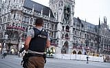 Illustrative: A policeman stands guard at the Marienplatz square in Munich, southern Germany, on July 22, 2016 (AFP/dpa/Sven Hoppe )