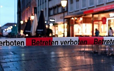 Police sign blocks the entrance to Odeon square following shootings at a shopping mall earlier on July 22, 2016 in Munich. (AFP Photo/dpa/Sven Hoppe)