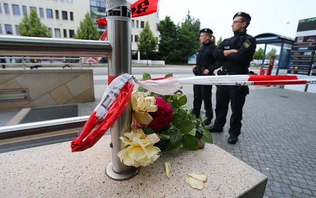 Police officers stand at the entrance of the subway station near the shopping mall Olympia Einkaufzentrum OEZ in Munich on July 23, 2016 a day after a gunman went on a shooting rampage in the busy shopping center, killing nine people. (AFP PHOTO/DPA/Karl-Josef Hildenbrand) Police officers stand at the entrance of the subway station near the shopping mall Olympia Einkaufzentrum OEZ in Munich on July 23, 2016 a day after a gunman went on a shooting rampage in the busy shopping center, killing nine people. (AFP PHOTO/DPA/Karl-Josef Hildenbrand)