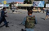 Afghan security personnel arrive after a suicide attack that targeted crowds of minority Shiite Hazaras during a demonstration at the Deh Mazang Circle of Kabul on July 23, 2016. (AFP/ WAKIL KOHSAR)