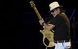 Mexican-born US guitarist Carlos Santana performs on stage during a concert at the Starlite music festival in Marbella on July 24, 2016. (AFP PHOTO / JORGE GUERRERO)