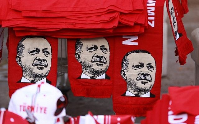 This picture taken on July 25, 2016, shows scarves with the effigy of Turkish President Recep Tayyip Erdogan a rally against the military coup in Ankara. (AFP/Adem Altan)