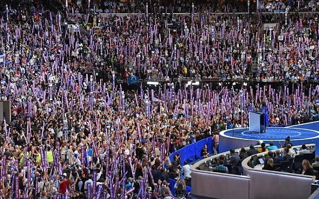 US First Lady Michelle Obama stands at the lectern as she addresses delegates on Day 1 of the Democratic National Convention at the Wells Fargo Center in Philadelphia, Pennsylvania, July 25, 2016. (AFP PHOTO / Timothy A. CLARY)