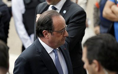 French President Francois Hollande stands outside the Saint-Etienne-du-Rouvray's city hall following a hostage-taking at a church of the town on July 26, 2016 (AFP PHOTO / CHARLY TRIBALLEAU)