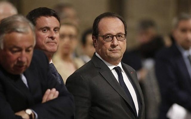 French President Francois Hollande, center attend a masss to pay tribute to the priest Jacques Hamel, killeda day earlier in his church of Saint Etienne du Rouvray during a hostage-taking claimed by Islamic State group, seen here in the Notre Dame Cathedral in Paris, July 27, 2016 . (AFP/POOL/BENOIT TESSIER) French President Francois Hollande, center attend a masss to pay tribute to the priest Jacques Hamel, killeda day earlier in his church of Saint Etienne du Rouvray during a hostage-taking claimed by Islamic State group, seen here in the Notre Dame Cathedral in Paris, July 27, 2016 . (AFP/POOL/BENOIT TESSIER)