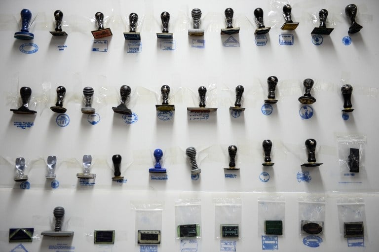 Fake immigration stamps are displayed at the Immigration Detention Center in Bangkok on July 22, 2016, after the arrest of the master forger known as 'The Doctor'. (AFP PHOTO/LILLIAN SUWANRUMPHA) Fake immigration stamps are displayed at the Immigration Detention Center in Bangkok on July 22, 2016, after the arrest of the master forger known as 'The Doctor'. (AFP PHOTO/LILLIAN SUWANRUMPHA)