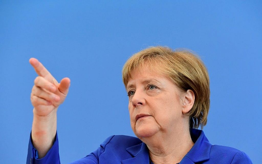 German Chancellor Angela Merkel gestures at a wide-ranging press conference on domestic and foreign policy  in Berlin on 28 July, 2016, following a spate of attacks that have reignited criticism of her liberal stance on asylum. (AFP/Tobias Schwarz)