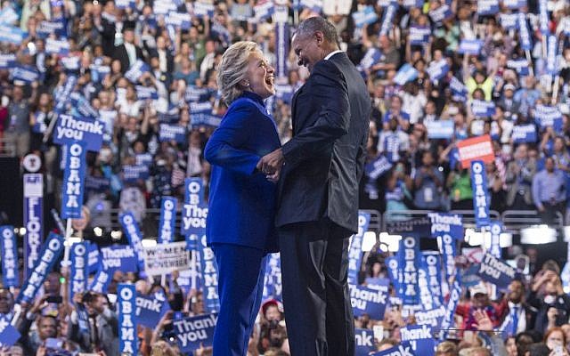 US President Barack Obama is joined by US Democratic presidential candidate Hillary Clinton after his address to the Democratic National Convention at the Wells Fargo Center in Philadelphia, Pennsylvania, July 27, 2016. (AFP/Mandel Ngan) US President Barack Obama is joined by US Democratic presidential candidate Hillary Clinton after his address to the Democratic National Convention at the Wells Fargo Center in Philadelphia, Pennsylvania, July 27, 2016. (AFP/Mandel Ngan)