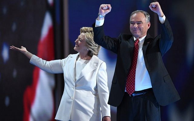 Presidential nominee Hillary Clinton walks with her vice presidential running mate Tim Kaine at the close of the fourth and final day of the Democratic National Convention in Philadelphia on July 28, 2016. (AFP PHOTO/Timothy A. CLARY)