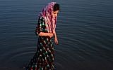 Illustrative: In this photograph taken on July 28, 2016, an Afghan girl stands in the Hari Rud river on the outskirts of Herat. (AFP/Aref Karim)