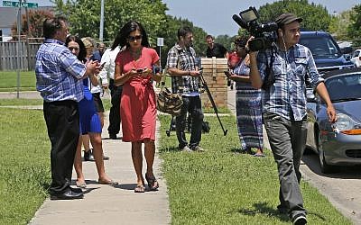 Members of the media descend on the neighborhood of Micah Xavier Johnson, 25, of Mesquite, Texas on on July 8, 2016 , a day after he is suspected of shooting five police officers in Dallas. (Stewart F. House/Getty Images/AFP