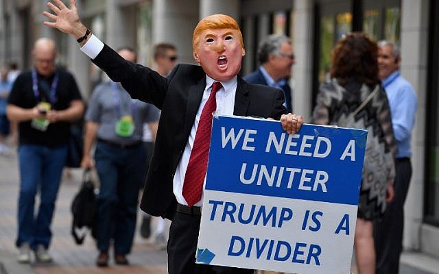 A man wearing a Donald Trump mask walks through downtown, ahead of the upcoming Republican National Convention on July 17, 2016 in Cleveland, Ohio. ( Jeff J Mitchell/Getty Images/AFP)