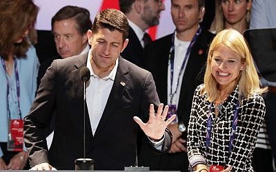 US Speaker of the House Paul Ryan (R-WI) speaks during a microphone test along with his wife Janna Ryan (R) prior to the start of the Republican National Convention on July 17, 2016 at the Quicken Loans Arena in Cleveland, Ohio. (Alex Wong/Getty Images/AFP)