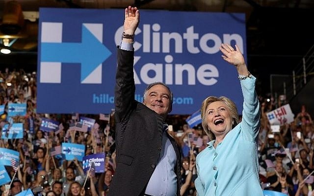 Democratic presidential candidate Hillary Clinton and Democratic vice presidential candidate US Sen. Tim Kaine (D-VA) greet supporters during a campaign rally at Florida International University Panther Arena on July 23, 2016 in Miami, Florida. (Justin Sullivan/Getty Images/AFP)