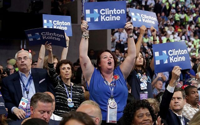 Attendees hold up signs in support of Democratic presidential nominee Hillary Clinton and US Vice President nominee Tim Kaine on the fourth day of the Democratic National Convention at the Wells Fargo Center, July 28, 2016 in Philadelphia, Pennsylvania. (Chip Somodevilla/Getty Images/AFP)
