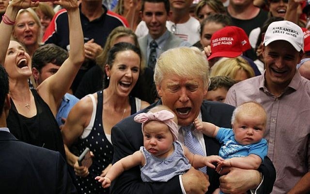 Republican presidential nominee Donald Trump reacts as he holds of three-month-old Kellen Campbell, of Denver, right, while holding six-month-old Evelyn Keane, of Castle Rock, Colo., after Trump's speech at the Gallogly Event Center on the campus of the University of Colorado on July 29, 2016 in Colorado Springs, Colorado. (Joe Mahoney/Getty Images/AFP) Republican presidential nominee Donald Trump reacts as he holds of three-month-old Kellen Campbell, of Denver, right, while holding six-month-old Evelyn Keane, of Castle Rock, Colo., after Trump's speech at the Gallogly Event Center on the campus of the University of Colorado on July 29, 2016 in Colorado Springs, Colorado. (Joe Mahoney/Getty Images/AFP)