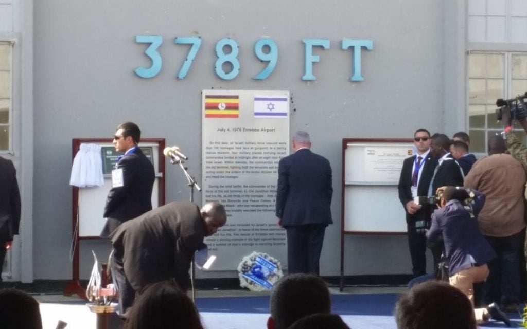 Prime Minister Benjamin Netanyahu lays a wreath commemorating the victims of the Entebbe raid on Sunday, July 4, 2016 (Raphael Ahren/Times of Israel)