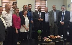 Former Saudi general Dr. Anwar Eshki (center, in striped tie) and other members of his delegation, meet with Israeli Knesset members and others during a visit to Israel on July 22, 2016. (via Twitter)