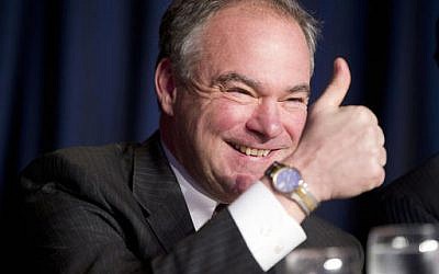 In this Feb. 4, 2016 photo, Sen. Tim Kaine, D-Va., gives a 'thumbs-up' as he takes his seat at the head table for the National Prayer Breakfast in Washington. (AP Photo/Pablo Martinez Monsivais, File)