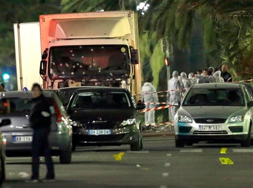 Forensic officers stand near a truck with its windscreen riddled with bullets, that plowed through a crowd of revelers who'd gathered to watch the fireworks in the French resort city of Nice, southern France, Friday, July 15, 2016. (AP Photo/Claude Paris) Forensic officers stand near a truck with its windscreen riddled with bullets, that plowed through a crowd of revelers who'd gathered to watch the fireworks in the French resort city of Nice, southern France, Friday, July 15, 2016. (AP Photo/Claude Paris)