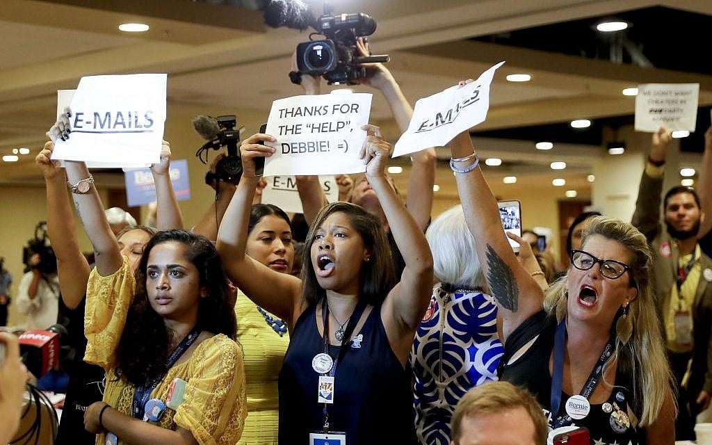 Protesters yell as DNC Chairwoman, Debbie Wasserman Schultz, D-Fla., arrives for a Florida delegation breakfast, Monday, July 25, 2016, in Philadelphia, during the first day of the Democratic National Convention. (AP Photo/Matt Slocum)