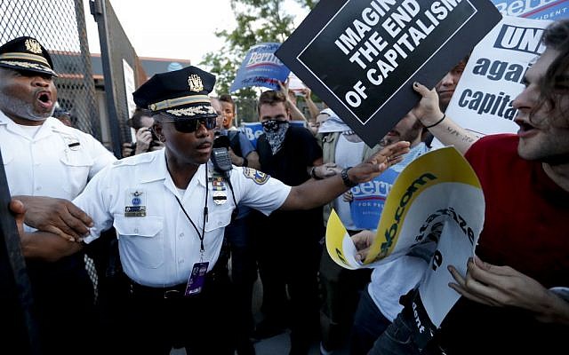 Demonstrators clash with police near the AT&T Station in Philadelphia, Tuesday, July 26, 2016, during the second day of the Democratic National Convention. (AP/Alex Brandon)