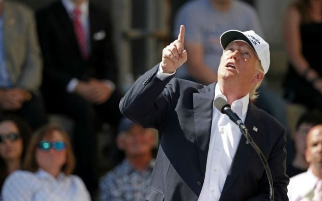 Republican presidential candidate Donald Trump points to an airplane passing overhead at a town hall-style campaign event at the former Osram Sylvania light bulb factory, Thursday, June 30, 2016, in Manchester, New Hampshire. (AP Photo/Robert F. Bukaty) Republican presidential candidate Donald Trump points to an airplane passing overhead at a town hall-style campaign event at the former Osram Sylvania light bulb factory, Thursday, June 30, 2016, in Manchester, New Hampshire. (AP Photo/Robert F. Bukaty)
