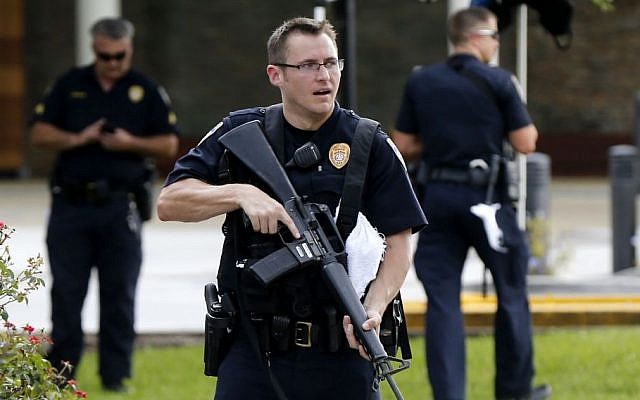 Police guard the emergency room entrance of Our Lady Of The Lake Medical Center, where wounded officers were brought, in Baton Rouge, La., Sunday, July 17, 2016. (AP/Gerald Herbert) Police guard the emergency room entrance of Our Lady Of The Lake Medical Center, where wounded officers were brought, in Baton Rouge, La., Sunday, July 17, 2016. (AP/Gerald Herbert)