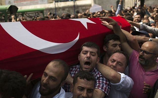 Mourners at a funeral carry the coffin of a person killed Friday while protesting against the attempted coup against Turkey's government, in Istanbul, Sunday, July 17, 2016. (AP Photo/Emilio Morenatti)