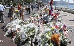Flowers and messages placed along the Promenade des Anglais in Nice on July 20, 2016, to honor the victims of the Bastille Day truck attack. (AP Photo/Claude Paris)