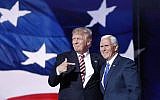 Republican presidential candidate Donald Trump points toward running mate Indiana Gov. Mike Pence after Pence's acceptance speech during the third day of the Republican National Convention in Cleveland, Ohio, Wednesday, July 20, 2016. (AP Photo/Mary Altaffer)
