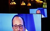 French President Francois Hollande is seen on giant screens as he delivers a speech during a meeting at Elysee Palace in Paris, Monday, May 23, 2016 (AP Photo/Francois Mori, pool)