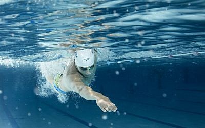 Rami Anis, 25, is Syria’s fastest swimmer in the 100-meter butterfly and now resides in a small town close to the Belgian city of Ghent. (International Olympic Committee)