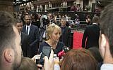 Writer J.K. Rowling talks to media on arrival at the gala performance of Harry Potter and the Cursed Child, at the Palace Theatre in central London, Saturday, July 30, 2016. (Joel Ryan/Invision/AP)