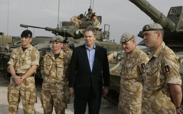 Then British prime ,inister Tony Blair meets soldiers at Shaibah logistics base, Basra, Iraq on December 22, 2005. (AP/Kirsty Wigglesworth)