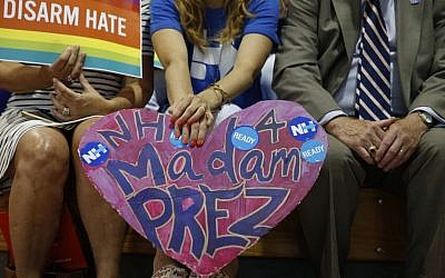 A woman holds poster for Democratic presidential candidate Hillary Clinton during a rally in Portsmouth, N.H., on July 12, 2016, where Sen. Bernie Sanders, I-Vt. endorsed her for president. (AP Photo/Andrew Harnik) 