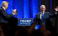 Republican presidential candidate Donald Trump, left, introduces Indiana Gov. Mike Pence, during a campaign event to announce Pence as the vice presidential running mate on, Saturday, July 16, 2016, in New York (AP Photo/Mary Altaffer)