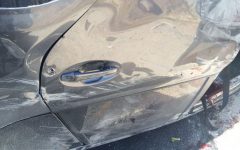 Illustrative. Bullet holes in the door of an Israeli car hit in a drive-by shooting near Hebron that killed at least one person on July 1, 2016 (IDF Spokesperson's Unit)