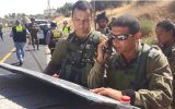 Judea Brigade commander Col. Yariv Ben-Ezra arrives on the scene of a shooting attack, in which one man died and three were injured, outside of Hebron on July 1, 2016. (IDF Spokesperson's Unit)