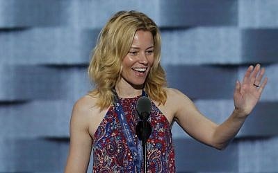 Actress Elizabeth Banks looks over the podium area during a sound check before the start of the second day of the Democratic National Convention in Philadelphia , Tuesday, July 26, 2016. (AP Photo/J. Scott Applewhite)